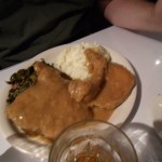 Morgan's smothered pork chops with collard greens and mashed potatoes at Sylvia's in Harlem. 17.06.12