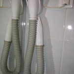 Wall-mounted hair dryer. Worse than useless.